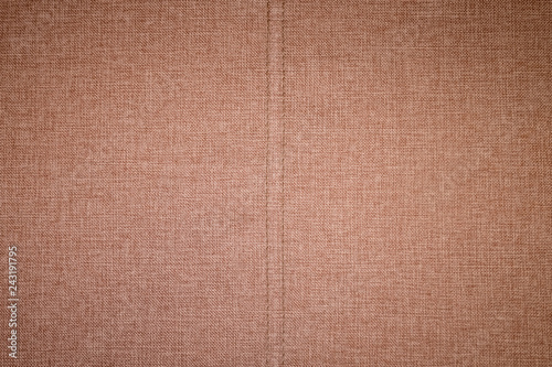 Textured background surface of textile upholstery furniture close-up. burlap brown Color fabric structure