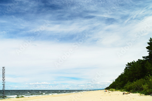 Landscape with stratocumulus clouds on the sky over the Baltic sea beach. Stegna, Pomerania, Poland.