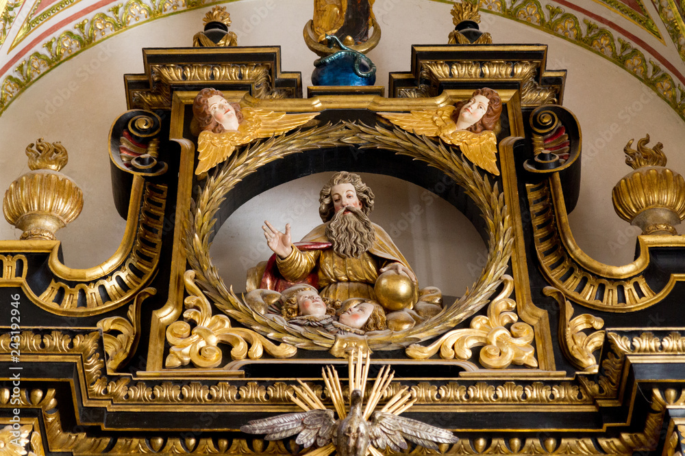 Trnava, Slovakia. 2018/4/12. A statue of God the Father in reredos (raredos), i.e. a large altarpiece. The Saint John the Baptist Cathedral in Trnava.