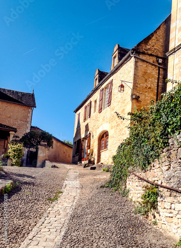 Medieval village of Aquitaine with its stone houses in the south of France on a cloudy day. © Tomas