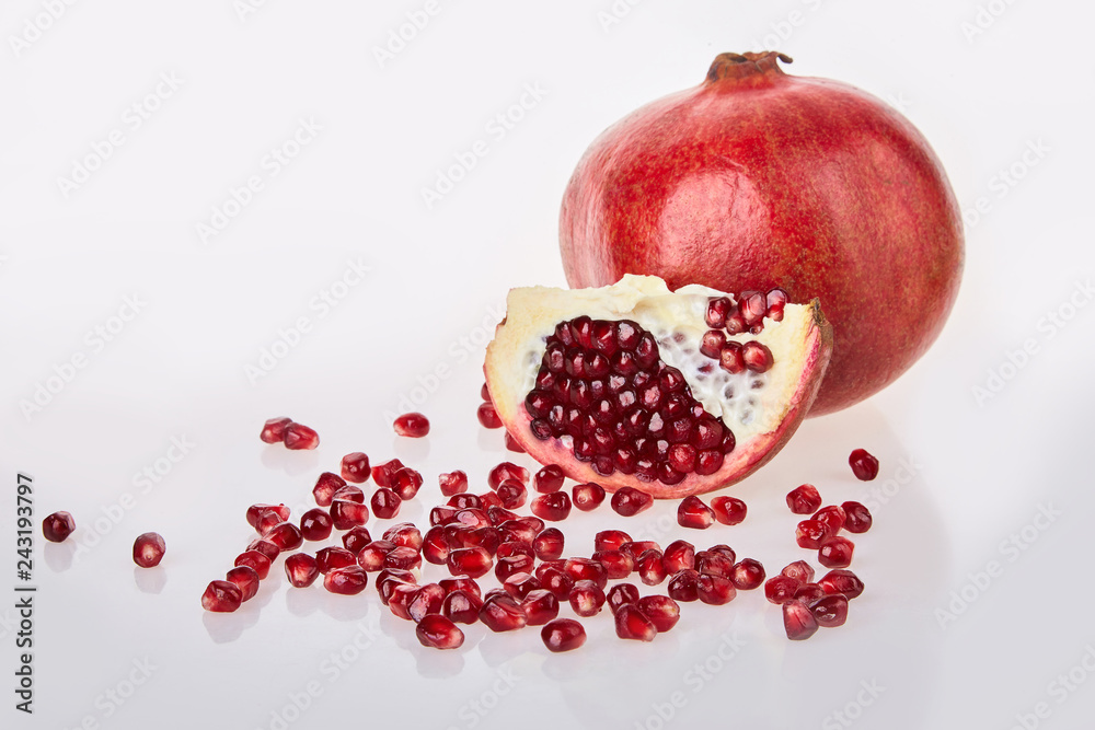 Close-up of pomegranate seeds texture on a white background, top view. Ripe red garnet fruit Close-up of pomegranate seeds texture on a white background, top view. Ripe red garnet fruit Close-up of pomegranate seeds texture on a white background, top view. Ripe red garnet fruit Close-up of pomegranate seeds texture on a white background, top view. Ripe red garnet fruit