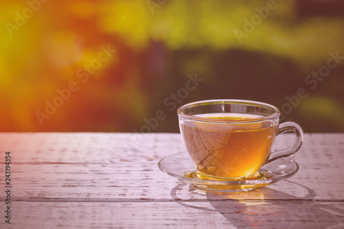 Fitness drink. Cup of fragrant, fragrant tea, in the rays of the evening warm sunset. Chamomile tea.
