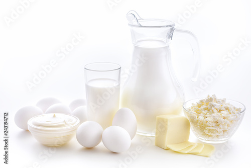 Milk, cottage cheese, sour cream, cheese, butter, eggs, still life from fresh dairy products. The usefulness of milk, dairy products from milk for adults and children.