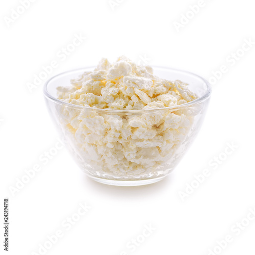 Plate with fresh cottage cheese on a white background. Very useful dairy product for the development of the child's body.