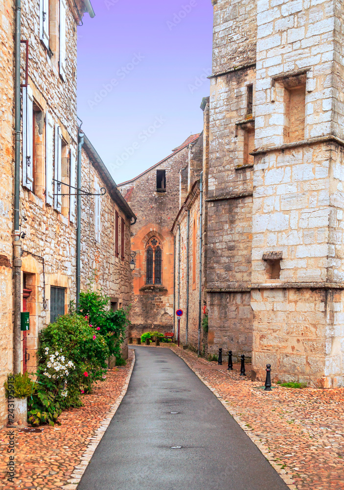 Medieval village of Aquitaine with its stone houses in the south of France on a cloudy day.