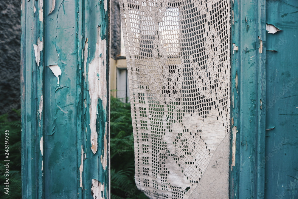 Fototapeta premium old wooden door, with lace curtain