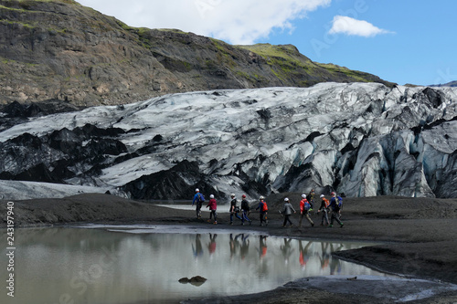Group of people on their way to an ice climbing tour on Sólheimajökull glacier, Iceland