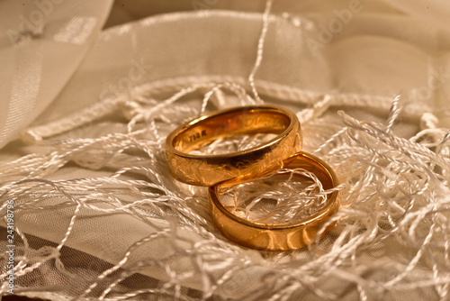 Two golden rings on a scarf photo