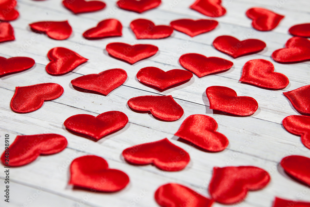 A lot of hearts on a wooden background, the concept of love and loyalty
