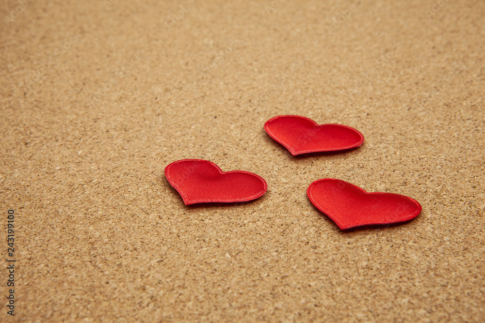 Red hearts on corkboard, strong love concept Red hearts on corkboard, strong love concept