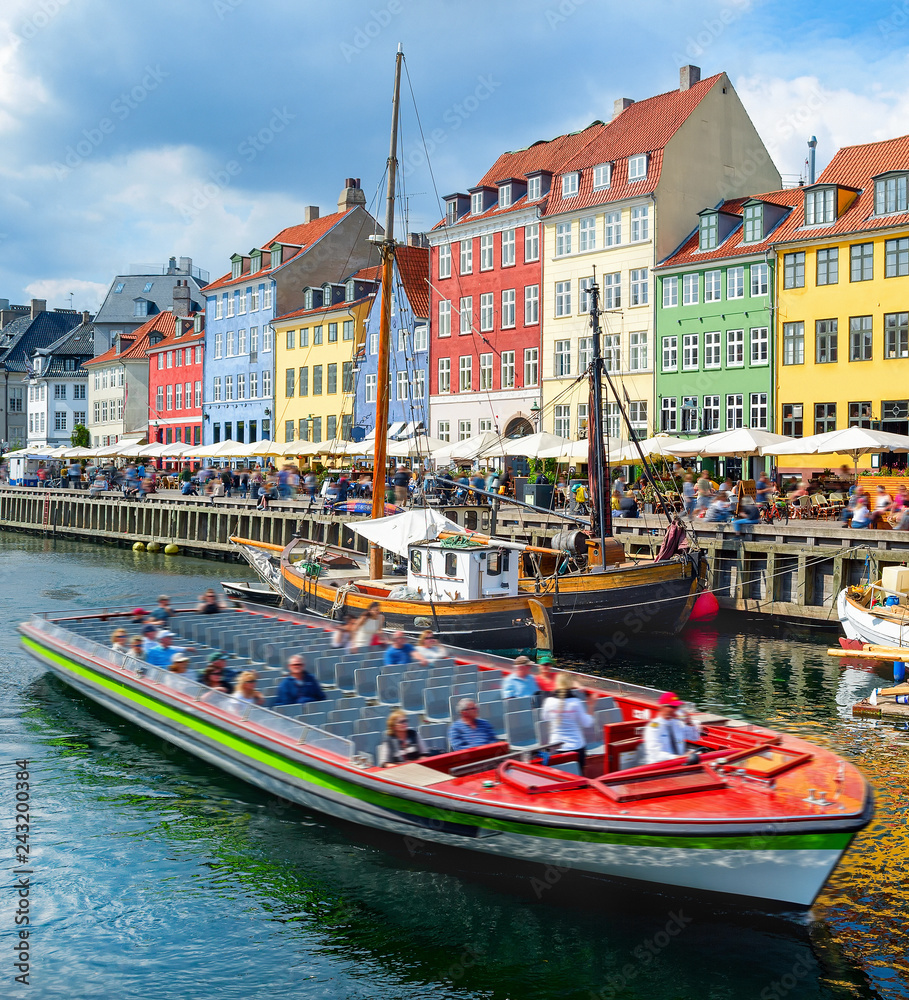 Touristic boat cruising by Nyhavn