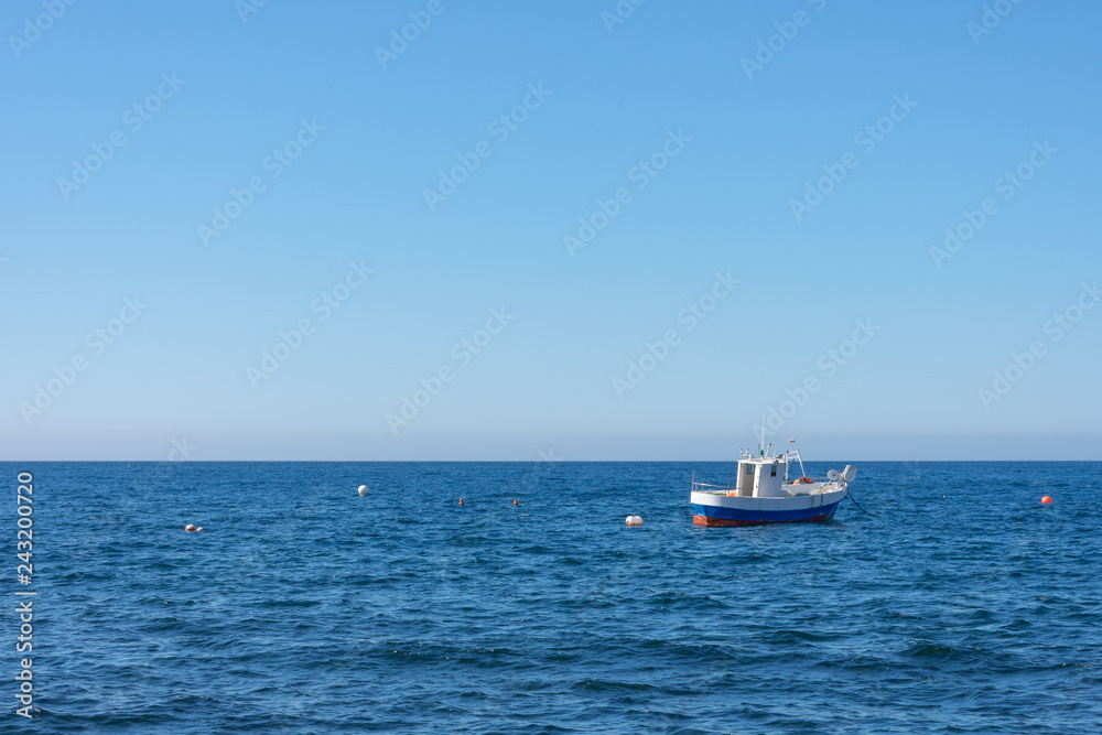 boat moored in the middle of the sea