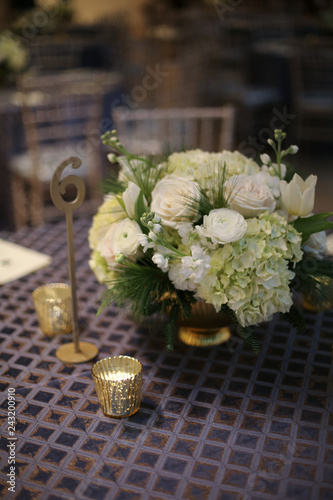 Wedding Photography Bridal Reception White Roses and Hydrangeas in a Centerpiece