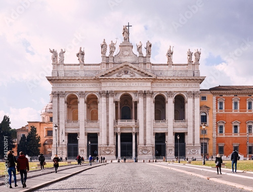 Italy, Rome, January 1/ 2019, St. John Lateran Basilica (Basilica di San Giovanni in Laterano) tourists walk on the avenue of the Basilica photo