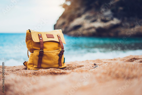 Hipster swimming mask on background blue sea ocean horizon, hiker tourist yellow backpack on sand beach, panoramic seascape blank, traveler relax holiday concept, sunlight view in trip vacation