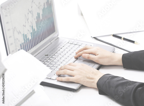 Female hands typing on the keyboard and while holding the mouse