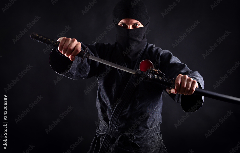Powerful ninja portrait with drawn sword Powerful ninja portrait with drawn sword