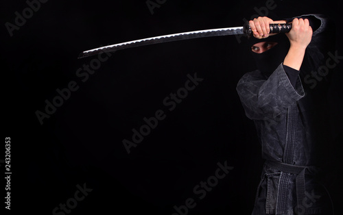 Ninja with katana close-up. Martial arts.