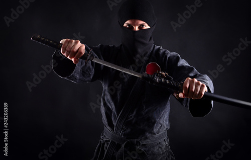 Powerful ninja portrait with drawn sword