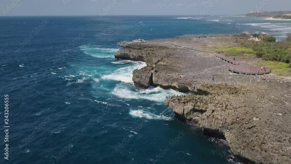 Aerial top view of waves crushing on rocks. Aerial top view of waves crushing on rocks.