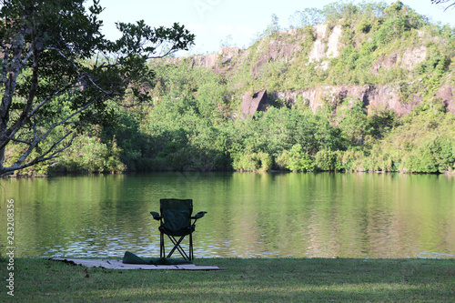 Camping chair near lake in summer the afternoon time natural light landscape view