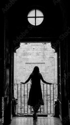 silhouette of a beautiful girl on the balcony of Castel del Monte in Puglia © Natalino Labianca