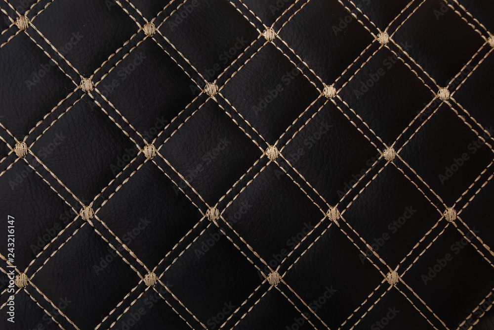 Fototapeta premium classic black leather Mat with straight beige stitching soft leather for machine with textured pattern concept background fabric business