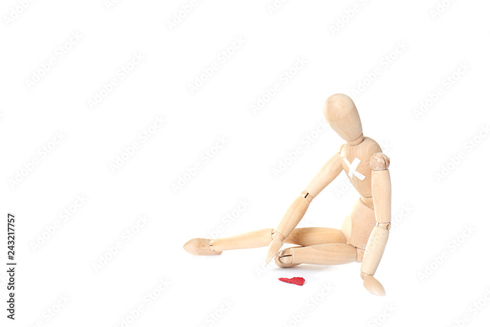 Wooden puppet with small heart on white background. Relationship problems Wooden puppet with small heart on white background. Relationship problems