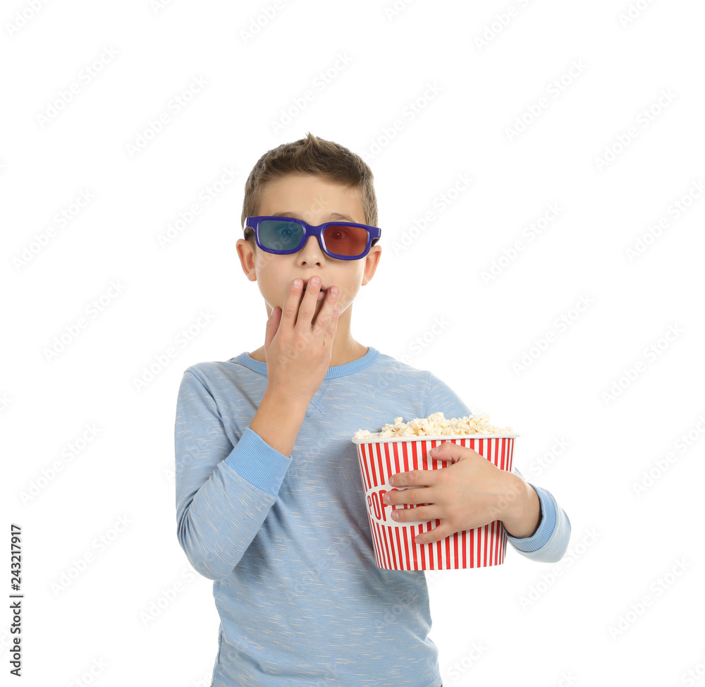 Naklejka premium Emotional boy with 3D glasses and popcorn during cinema show on white background