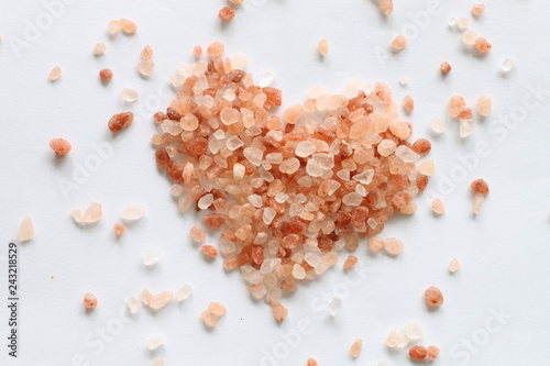 Heart made of himalayan salt on white background