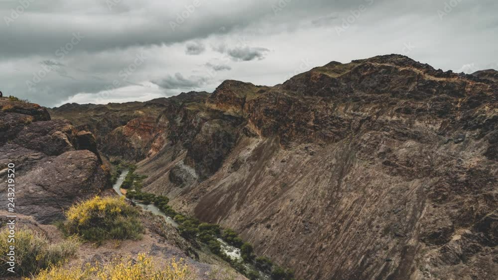 4k Moving Timelapse movie film of River in Charyn Canyon in South East Kazakhstan with blue sky during sunset. 4k Moving Timelapse movie film of River in Charyn Canyon in South East Kazakhstan with blue sky during sunset.