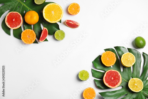 Different citrus fruits on white background  flat lay. Space for text