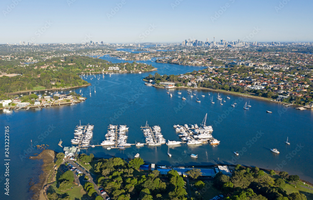 Aerial view of the Parramatta river and the Sydney city skyline to the east.