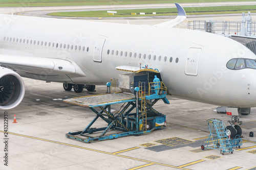 Loading platform of air freight to the aircraft. Food for flight check-in services and equipment to ready before boarding the airplane.