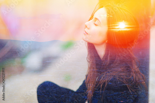 Fototapeta Double multiply exposure portrait of a dreamy cute woman meditating outdoors with eyes closed, combined photograph of nature, sunrise or sunset