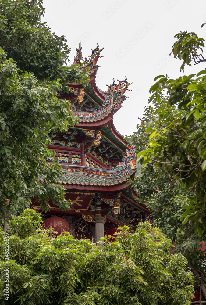 XIAMEN, CHINA - OCTOBER 31, 2018: Detail of roof carvings on South Putuo or Nanputuo Temple XIAMEN, CHINA - OCTOBER 31, 2018: Detail of roof carvings on South Putuo or Nanputuo Temple