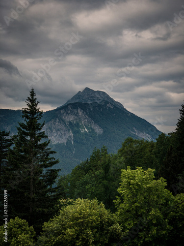 Scenic view of mountain against cloudy sky