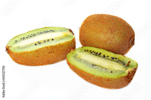 Two halves and whole yellow tropical exotic kiwi fruit on white background. Isolated