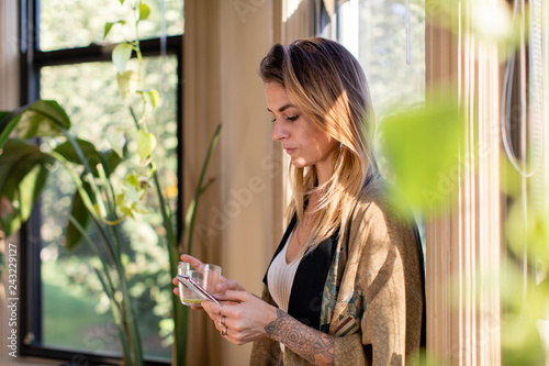 Woman checking her phone in the morning photo