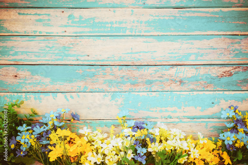 flowers blossom on vintage wooden background, border frame design. vintage color tone - concept flower of spring or summer background
