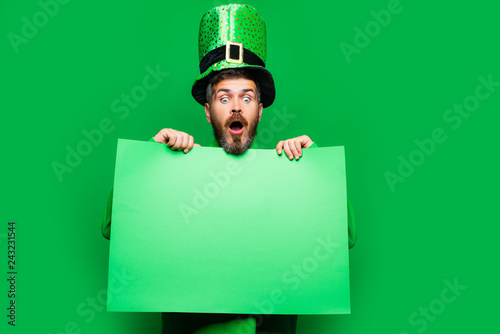Man on green background celebrate St Patricks Day. Green patricks background. Copy space. photo