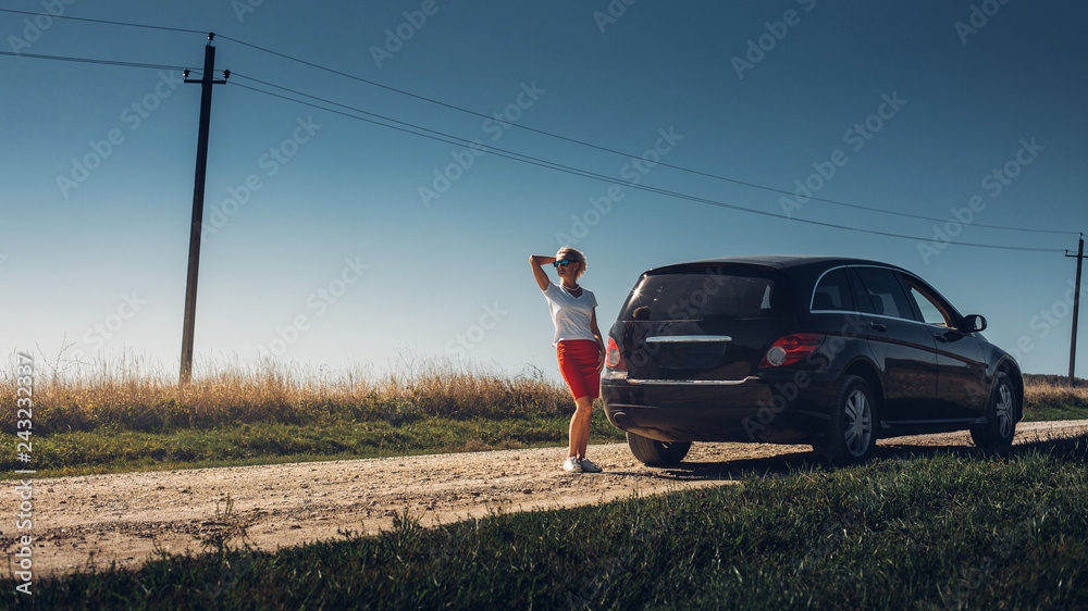 Beautiful adult woman enjoying road trip. Successful woman freedom holidays concept. Vacation, motivation, well-being, sightseeng
