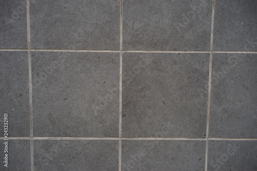 grey tile siding on building