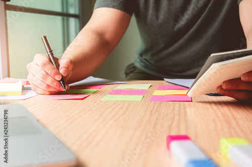 New. Business man holding pen meeting at home office and using notes paper share design planning ,brainstorming brainstorm idea on desktop