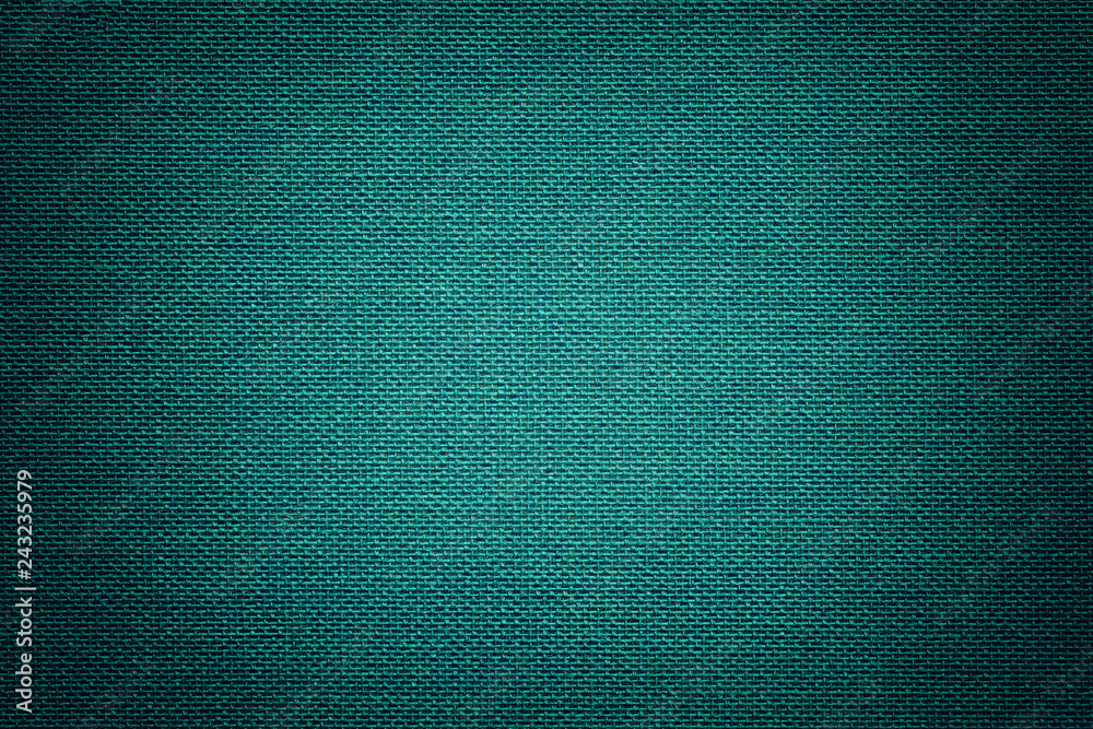 Turquoise background from a textile material with wicker pattern, closeup. Turquoise background from a textile material with wicker pattern, closeup.