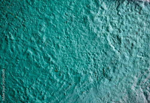 Rough teal colored painted plaster