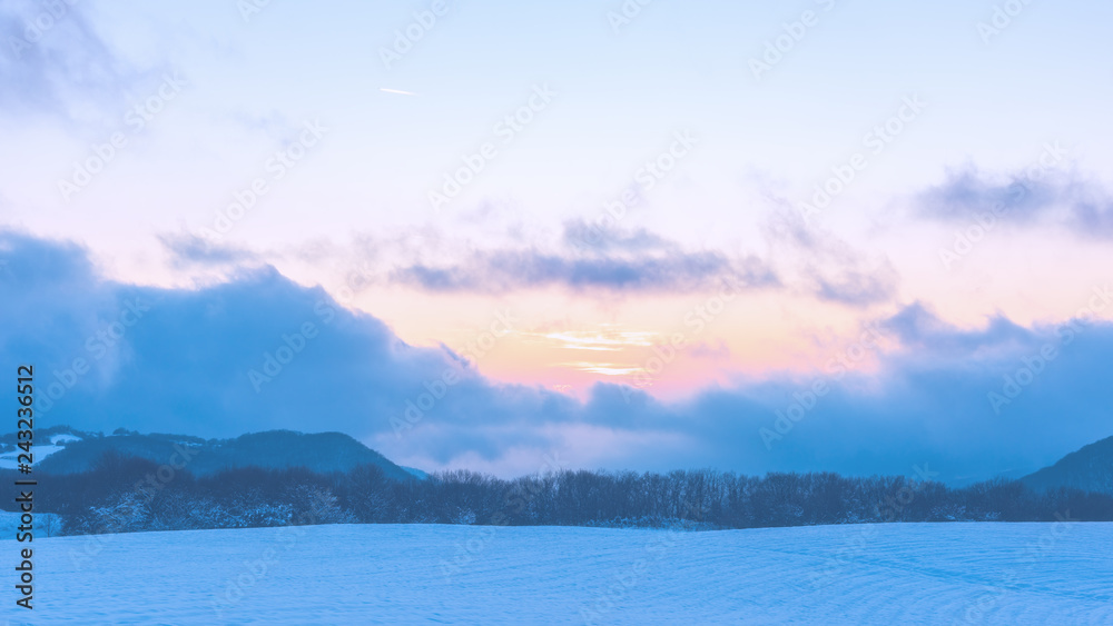 Amazing beautiful winter sunset in the mountains