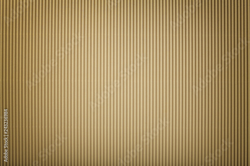 Texture of corrugated bronze paper with vignette, macro.