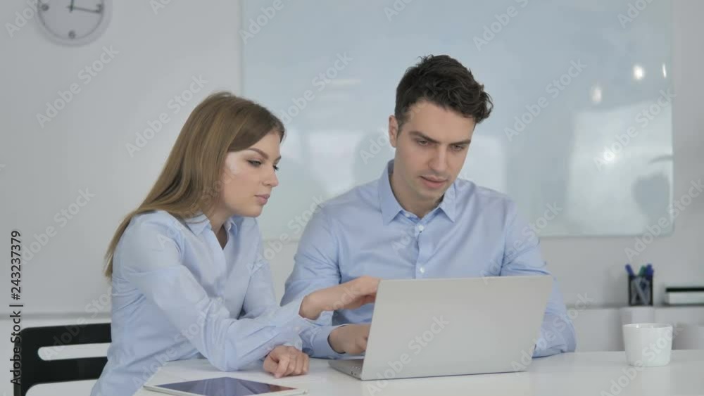 Young Colleagues Working Together on New Business Project Young Colleagues Working Together on New Business Project