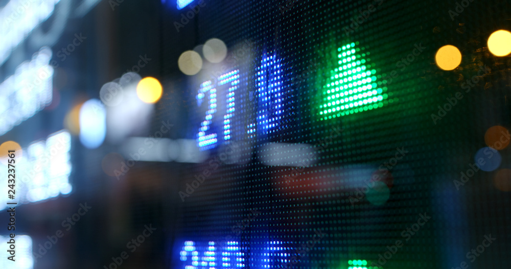 Stock market quotes in city at night